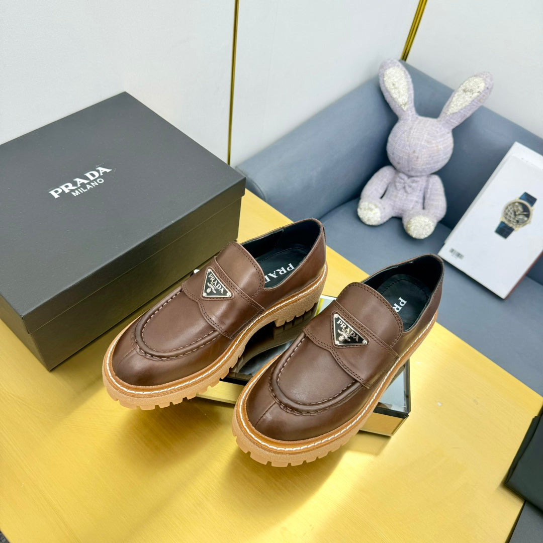 LOAFER WITH TRIANGLE LOGO IN CHOCOLATE BROWN CALFSKIN