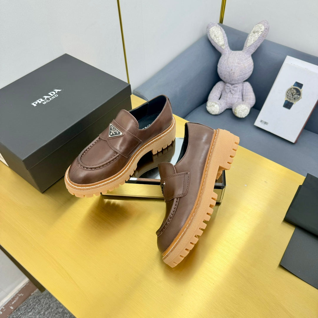 LOAFER WITH TRIANGLE LOGO IN CHOCOLATE BROWN CALFSKIN