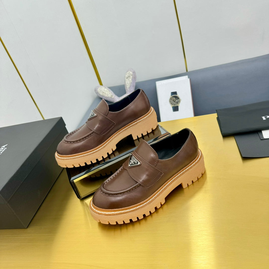 LOAFER WITH TRIANGLE LOGO IN CHOCOLATE BROWN CALFSKIN