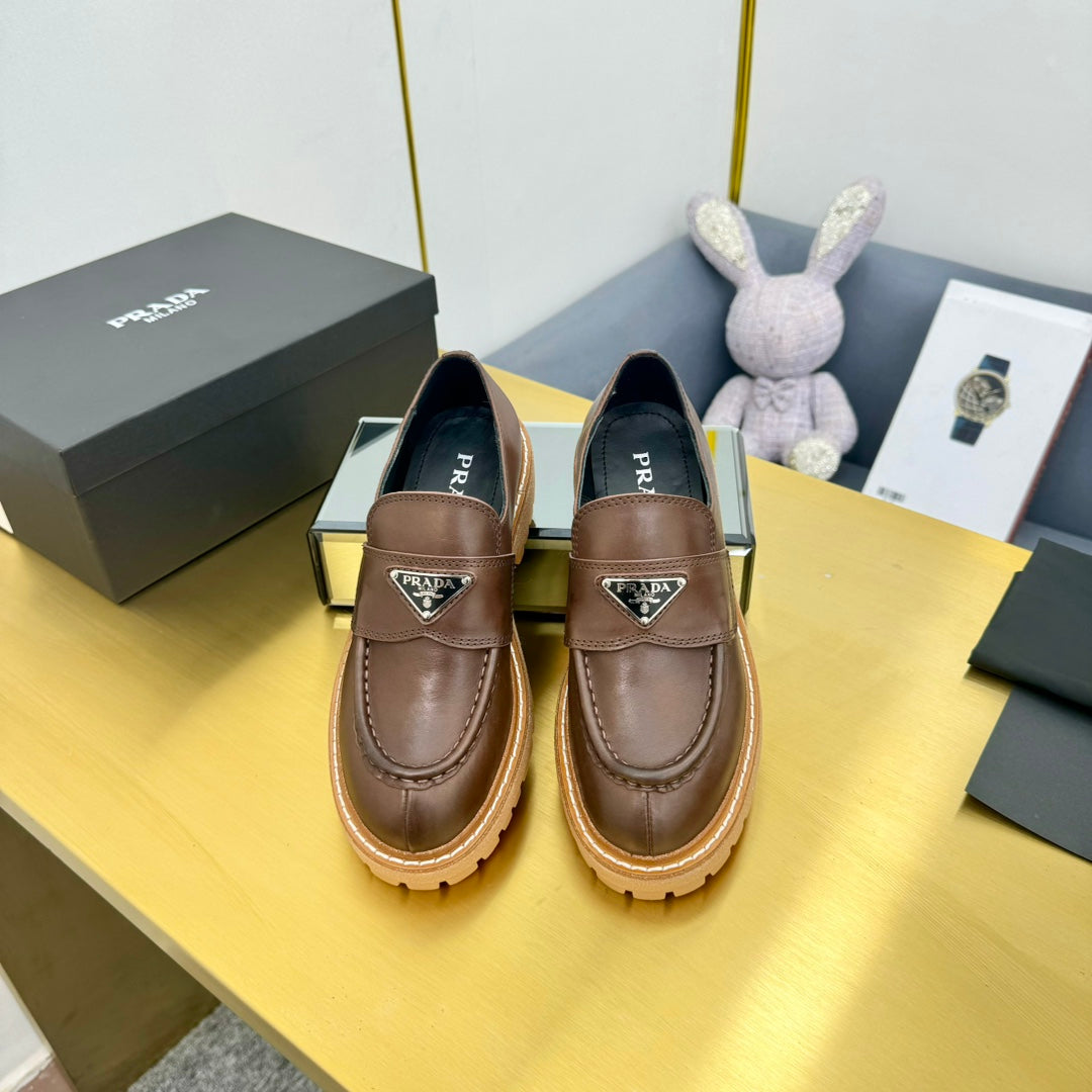 LOAFER WITH TRIANGLE LOGO IN CHOCOLATE BROWN CALFSKIN