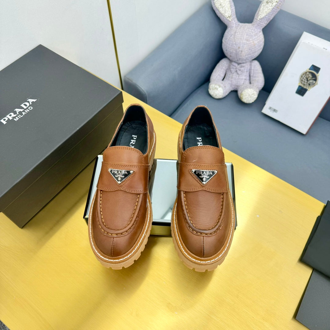LOAFER WITH TRIANGLE LOGO IN COGNAC CALFSKIN