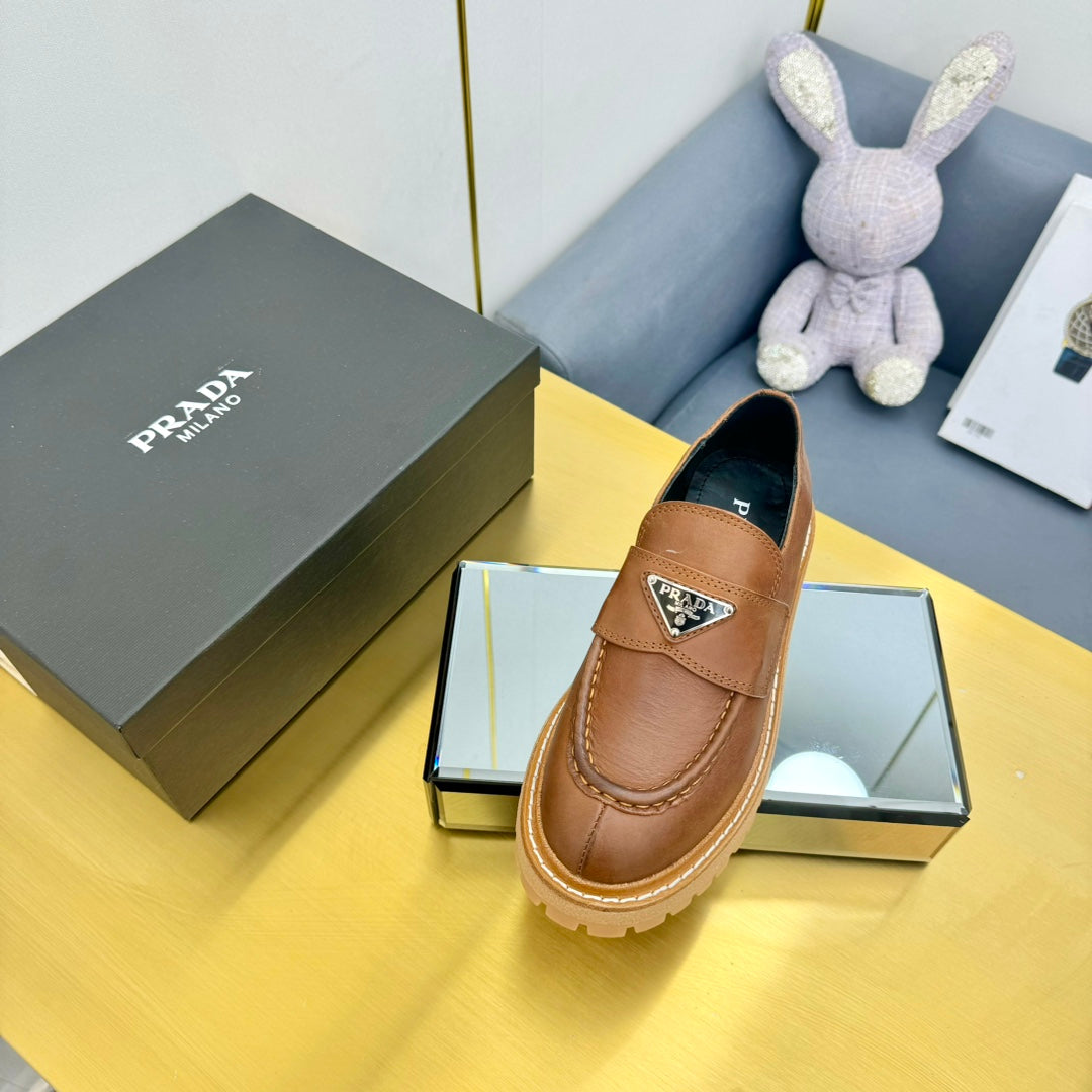 LOAFER WITH TRIANGLE LOGO IN COGNAC CALFSKIN