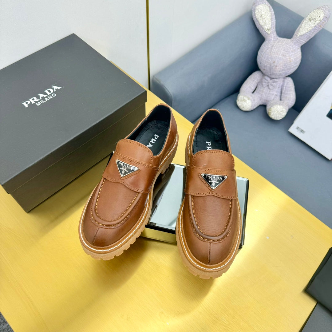 LOAFER WITH TRIANGLE LOGO IN COGNAC CALFSKIN