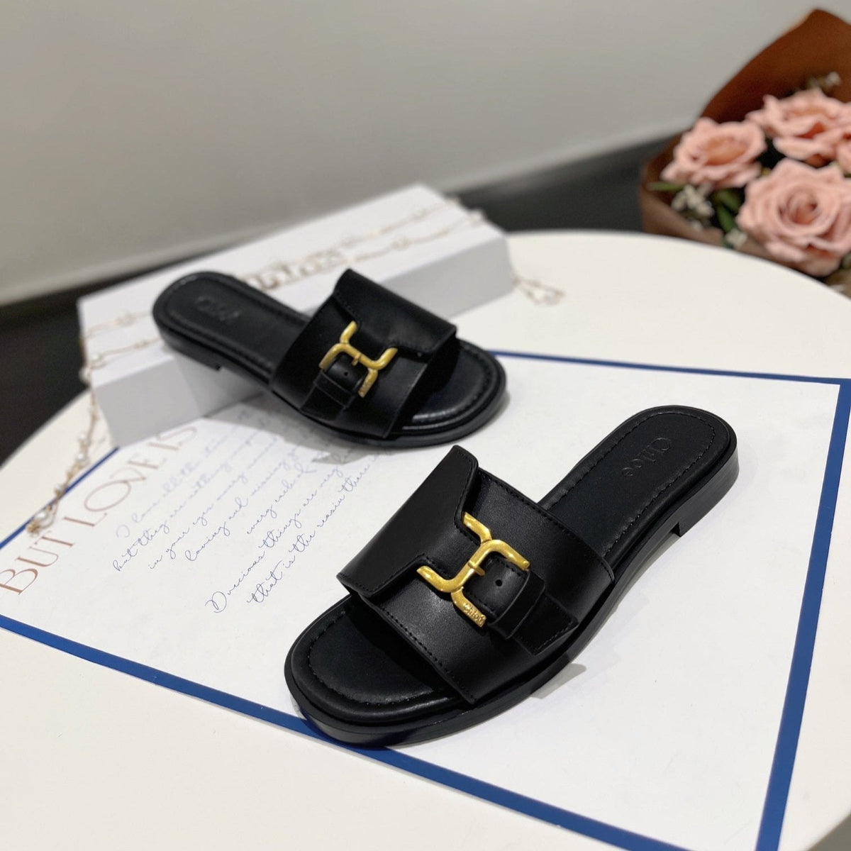 MARCIE SLIDE IN BLACK CALFSKIN WITH GOLD HARDWARE