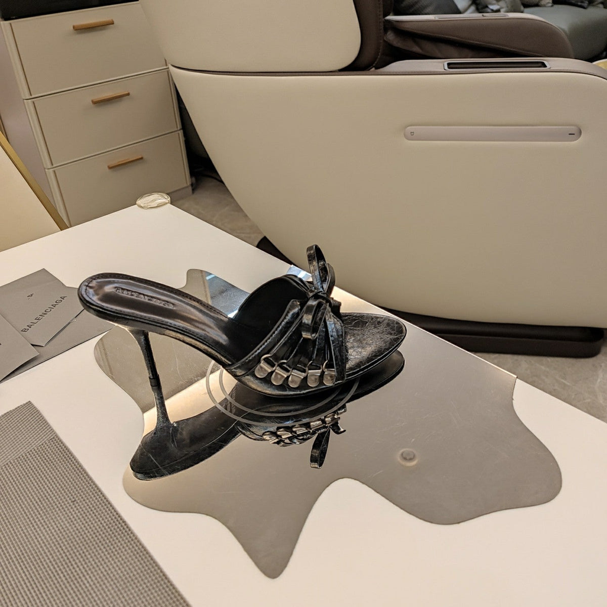 BOW-EMBELLISHED HIGH MULES IN BLACK SHEEPSKIN