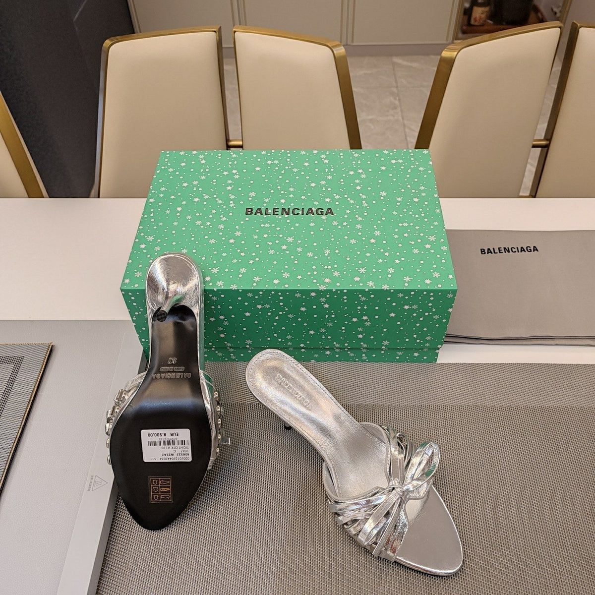 BOW-EMBELLISHED HIGH MULES IN SILVER METALLIC SHEEPSKIN