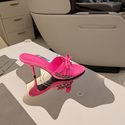 BOW-EMBELLISHED HIGH MULES IN HOT PINK SHEEPSKIN