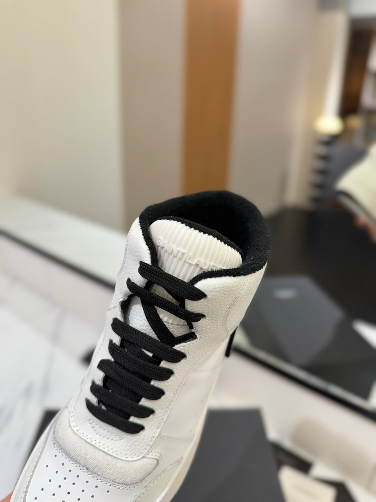 MID-TOP SNEAKERS IN WHITE AND BLACK TRIM PERFORATED LAMBSKIN