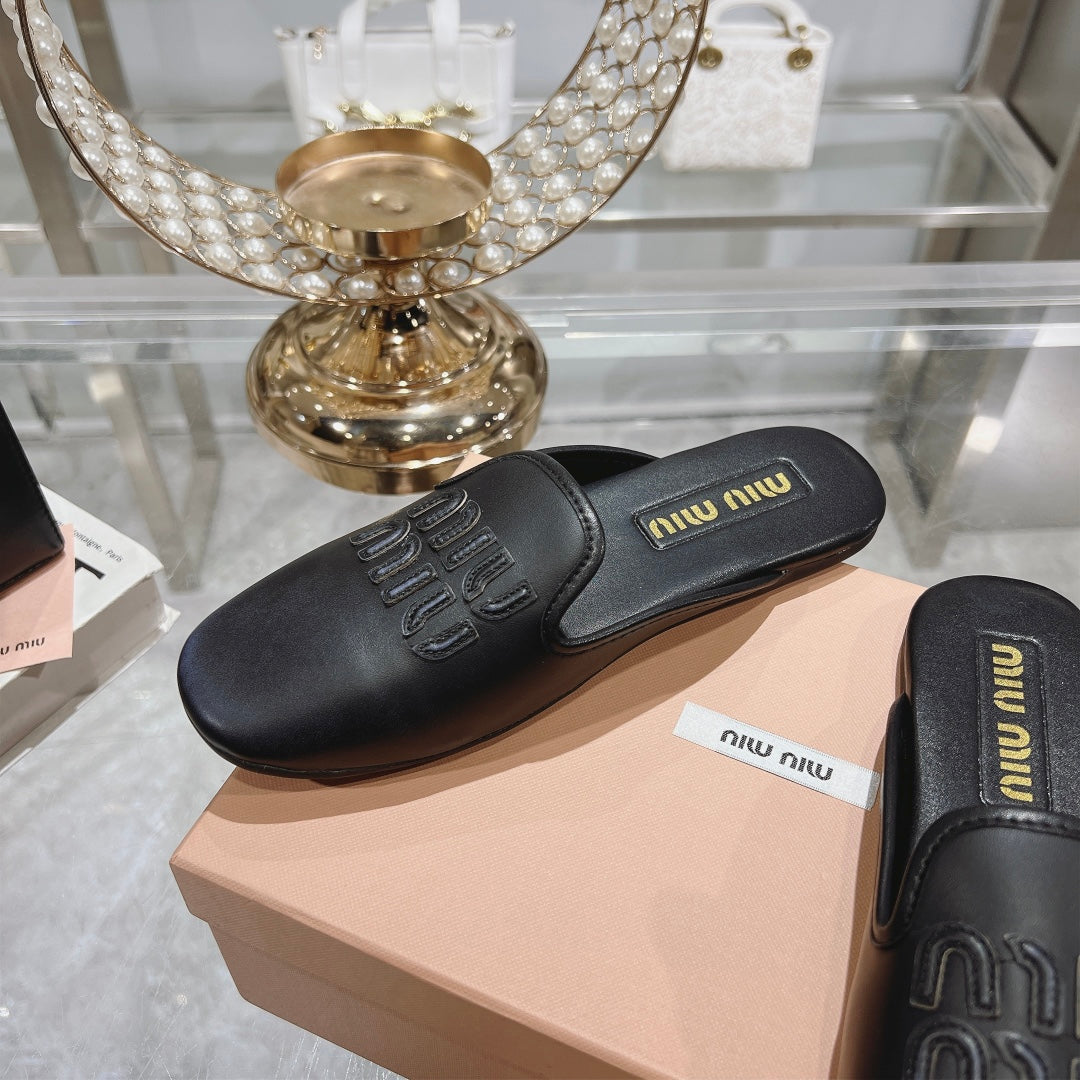 MULES SLIPPERS BLACK COWHIDE