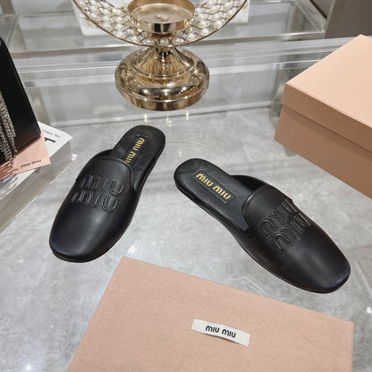 MULES SLIPPERS BLACK COWHIDE